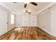 Large main bedroom offers dual closets, tray ceiling and sleek wood flooring at 4989 Post Oak Ln, Rock Hill, SC 29732