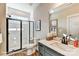 Contemporary bathroom features a glass enclosed shower, tile floors, quartz countertop and ample storage at 5380 Pembrey Dr # Lot 26, Denver, NC 28037