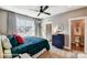 Cozy bedroom with large windows, stylish furnishings, and ensuite bathroom for comfort and convenience at 5380 Pembrey Dr # Lot 26, Denver, NC 28037