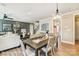 Dining area situated between the living room and staircase, featuring a hanging light fixture above the table at 5380 Pembrey Dr # Lot 26, Denver, NC 28037