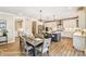 Elegant dining area featuring pendant lights, open layout, and a view of the modern island kitchen at 5380 Pembrey Dr # Lot 26, Denver, NC 28037