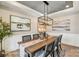Inviting dining room features a rustic wood table, stylish decor, and views to the kitchen at 5380 Pembrey Dr # Lot 26, Denver, NC 28037