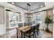 Formal dining room featuring a modern light fixture, a large window, and seamless flow to living spaces at 5380 Pembrey Dr # Lot 26, Denver, NC 28037