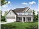 Charming two-story home featuring a covered front porch and a well-manicured lawn with beautiful landscaping at 5380 Pembrey Dr # Lot 26, Denver, NC 28037