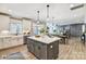 Spacious kitchen featuring a large island, stainless steel appliances, and seamless flow to dining and living areas at 5380 Pembrey Dr # Lot 26, Denver, NC 28037