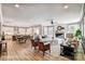 Bright, open-concept living area featuring a fireplace, abundant natural light, and seamless flow to the modern kitchen at 5380 Pembrey Dr # Lot 26, Denver, NC 28037