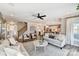 Open-concept living area showcasing a seamless transition to the kitchen and staircase, ideal for entertaining guests at 5380 Pembrey Dr # Lot 26, Denver, NC 28037