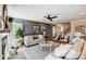 Spacious living room with a fireplace, accent wall, and staircase leading to upper level, perfect for Gathering living at 5380 Pembrey Dr # Lot 26, Denver, NC 28037