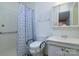 Bathroom with shower, toilet, sink, and medicine cabinet at 5623 Eastbrook Rd, Charlotte, NC 28215