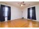Bedroom featuring hardwood floors, ceiling fan, and windows at 5623 Eastbrook Rd, Charlotte, NC 28215