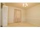 The dining room with neutral walls and carpet with a chandelier at 5623 Eastbrook Rd, Charlotte, NC 28215
