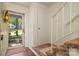 Bright entryway with hardwood floors, and view of the home's staircase at 5623 Eastbrook Rd, Charlotte, NC 28215