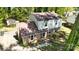 Charming two-story brick home with a well-maintained lawn and mature trees at 5623 Eastbrook Rd, Charlotte, NC 28215