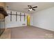 Living room boasts carpet floor and fireplace at 5623 Eastbrook Rd, Charlotte, NC 28215