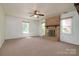 Living room with carpet floor and brick fireplace at 5623 Eastbrook Rd, Charlotte, NC 28215