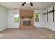 Living room with brick fireplace at 5623 Eastbrook Rd, Charlotte, NC 28215