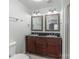 Bathroom with double sink vanity, updated fixtures, and a mirror at 589 Lippard Farm Rd, Statesville, NC 28625