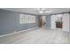 Bright bedroom with a ceiling fan, updated flooring, and view of the backyard at 589 Lippard Farm Rd, Statesville, NC 28625