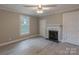 Bedroom featuring light gray walls, a fireplace, and large window at 589 Lippard Farm Rd, Statesville, NC 28625