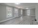 Bright, neutral living room with ample natural light, gray walls, and light wood floors at 589 Lippard Farm Rd, Statesville, NC 28625