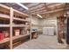 Finished basement featuring storage shelves, laundry area, and laminate wood-look flooring at 6008 Corkstone Dr, Mint Hill, NC 28227