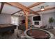 The finished basement is virtually staged with a pool table, poker table and fireplace at 6008 Corkstone Dr, Mint Hill, NC 28227