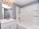 Bathroom with white vanity, mirror, and tub/shower combo with shower caddy at 6008 Corkstone Dr, Mint Hill, NC 28227