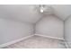 Cozy carpeted bedroom featuring vaulted ceiling and ceiling fan at 6008 Corkstone Dr, Mint Hill, NC 28227