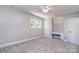 Bedroom with grey carpet, a ceiling fan, a desk, and a bright window at 6008 Corkstone Dr, Mint Hill, NC 28227