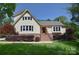 Charming two-story home with landscaped front yard and traditional architectural details at 6008 Corkstone Dr, Mint Hill, NC 28227