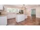 Bright kitchen with granite countertops, stainless steel appliances, and a center island at 6008 Corkstone Dr, Mint Hill, NC 28227