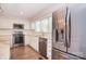 Well-lit kitchen with stainless steel appliances, white cabinetry and granite countertops at 6008 Corkstone Dr, Mint Hill, NC 28227