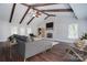 Spacious living room with exposed beams, fireplace, and hardwood floors at 6008 Corkstone Dr, Mint Hill, NC 28227