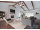 Living room features vaulted ceilings, fireplace with brick surround, and hardwood floors at 6008 Corkstone Dr, Mint Hill, NC 28227