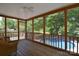 Cozy screened-in porch offering views of the backyard and pool at 6008 Corkstone Dr, Mint Hill, NC 28227