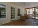 Relaxing screened-in porch with comfortable seating and ceiling fan at 6008 Corkstone Dr, Mint Hill, NC 28227