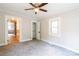 Bedroom featuring neutral walls, updated ceiling fan, and access to a closet at 606 W 19Th Ave, Gastonia, NC 28052