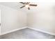 Carpeted bedroom featuring neutral walls and updated ceiling fan at 606 W 19Th Ave, Gastonia, NC 28052