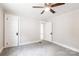 Bedroom with carpet, neutral walls, ceiling fan, and multiple entryways at 606 W 19Th Ave, Gastonia, NC 28052