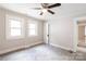 Bedroom with carpet, neutral walls, ceiling fan, and natural light from 2 windows at 606 W 19Th Ave, Gastonia, NC 28052