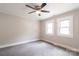 Bedroom with carpet, neutral walls, ceiling fan, and good natural light at 606 W 19Th Ave, Gastonia, NC 28052