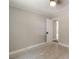 Neutral painted bedroom features window, interior door, overhead lighting, and tile flooring at 606 W 19Th Ave, Gastonia, NC 28052