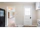 Bright kitchen with laminate floors, white cabinets, and a black fridge at 606 W 19Th Ave, Gastonia, NC 28052