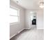 Bright living room with updated flooring and view into kitchen area at 606 W 19Th Ave, Gastonia, NC 28052