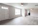 Bright, open living room with a large window, new floors and fresh paint at 606 W 19Th Ave, Gastonia, NC 28052