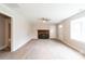 Inviting living room with a decorative fireplace, large window, and plenty of space at 606 W 19Th Ave, Gastonia, NC 28052