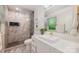 Modern bathroom showcasing a glass shower, elegant tiling, contemporary vanity, and natural lighting at 7230 Ridge Lane Rd, Charlotte, NC 28262