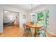 Bright dining room with a bay window and hardwood floors, perfect for Gathering meals at 7230 Ridge Lane Rd, Charlotte, NC 28262