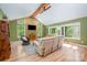Bright living room with exposed wood beams, large windows, and comfortable seating at 7230 Ridge Lane Rd, Charlotte, NC 28262