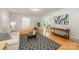 Inviting living room featuring hardwood floors, stylish rug, comfortable seating, and natural light at 7230 Ridge Lane Rd, Charlotte, NC 28262